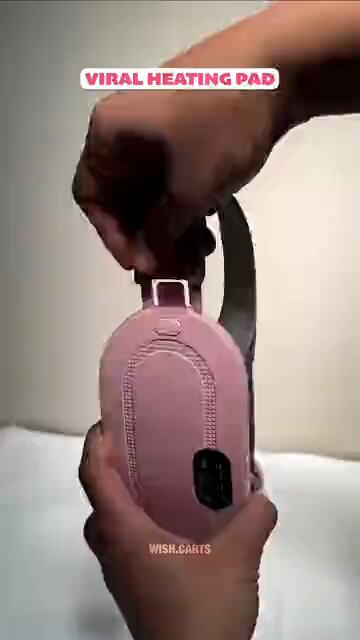 A heating pad for period pain shown against a pink background